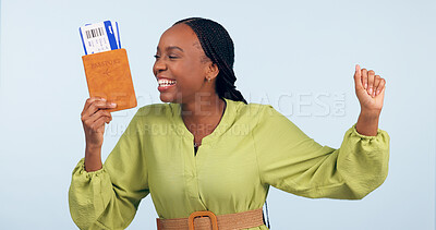 Buy stock photo African woman, passport and studio with fist celebration for airplane ticket, document or excited by blue background. Girl, legal paperwork and win for compliance, immigration or international travel