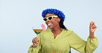 Woman, dance and sing for vacation in studio for mockup for party on blue background. African person, sunglasses and flowers on head for fashion with drink, fun and energy for celebration in space