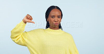 Buy stock photo Thumbs down, portrait and hands of woman in studio for rejection of bad news, complaint and no feedback on blue background. African model show emoji sign for review of wrong decision, icon or failure