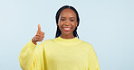 Portrait, opportunity and black woman with thumbs up, support and decision on a blue studio background. Face, African person and model with hand gesture, sign and feedback with review and emoji