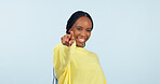 Pointing to you, motivation and black woman with opportunity, choice and announcement on a blue studio background. African person, model or girl with hand gesture, mockup space and feedback with news