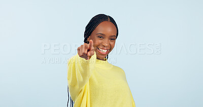 Buy stock photo Pointing to you, motivation and black woman with opportunity, choice and announcement on a blue studio background. African person, model or girl with hand gesture, mockup space and feedback with news