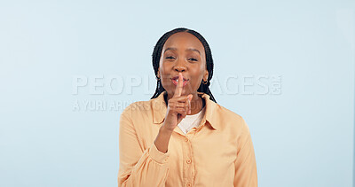 Buy stock photo Black woman, whisper or finger on lips for secret, gossip or confidential information on blue background. Studio, portrait and person sign for quiet, hush or privacy emoji for surprise announcement