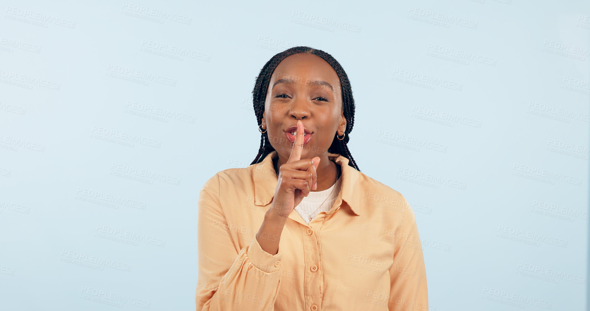 Buy stock photo Black woman, whisper or finger on lips for secret, gossip or confidential information on blue background. Studio, portrait and person sign for quiet, hush or privacy emoji for surprise announcement