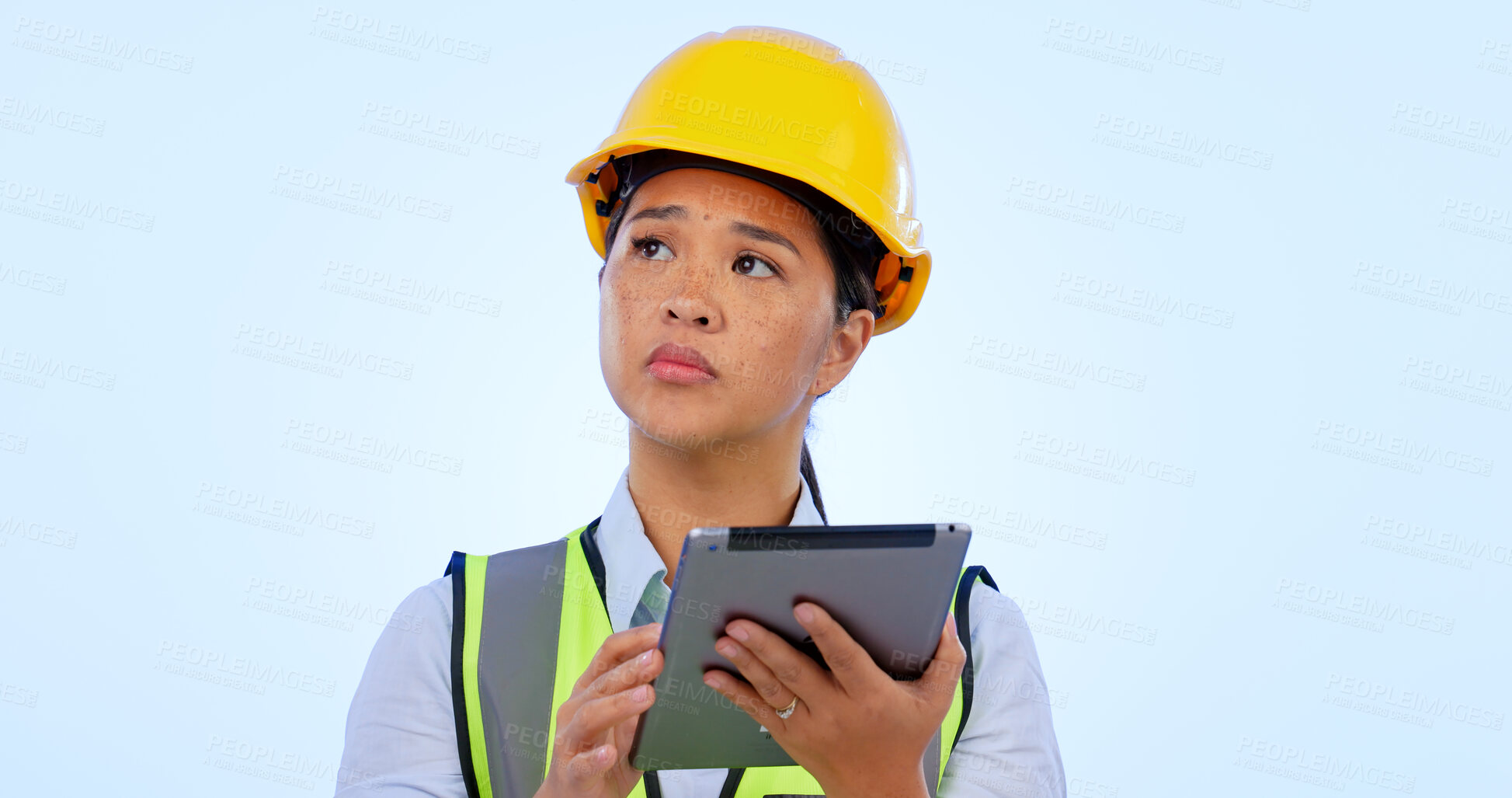 Buy stock photo Engineer, woman and thinking with tablet for construction, project management and studio by blue background. Asian female, architecture and development or real estate, planning and safety in mockup