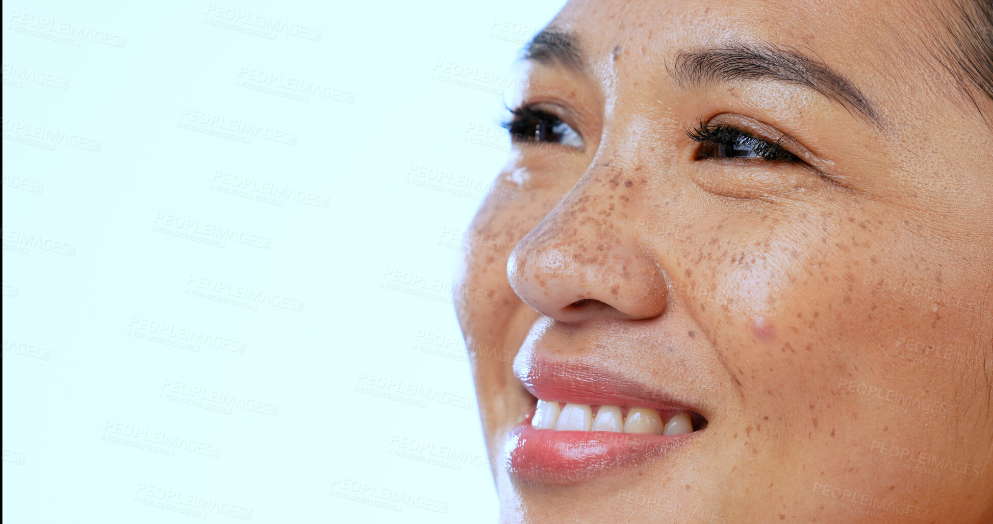 Buy stock photo Face, woman and smile with thinking or closeup in studio on blue background and mock up space for memory. Daydreaming, person and happiness with idea, mindset and fantasy for planning and vision