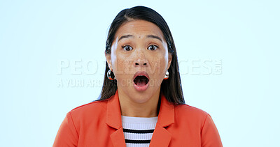 Buy stock photo Portrait, wow and shock with an asian woman in studio on a blue background to hear gossip or an announcement. Face, emoji and surprise with a mind blown young person looking amazed by fake news