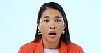 Woman, portrait and surprised or shocked in studio for announcement, scared and mouth open on blue background. Face, person and wow emoji or omg facial expression, mind blown and amazed at gossip