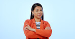 Asian business woman, arms crossed and studio with leadership portrait for career by blue background. Japanese entrepreneur, confident face and professional with pride, startup or corporate job