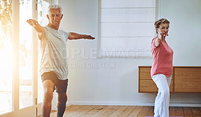 Buy stock photo Shot of a senior couple doing yoga together