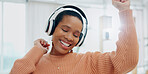 Happy, celebration and black woman with headphones, home and streaming music with happiness. African person, apartment and girl with headset, listening to sound and audio with technology and energy