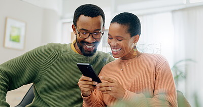 Buy stock photo Happy, home phone and relax black couple reading, smile or watch social media video, blog or relationship news. Smartphone, mobile application and African man, woman or marriage people check web info