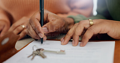 Buy stock photo Closeup, hands and signature on mortgage paperwork for finance, home contract or a loan. Investment, legal and a couple writing on a document for keys of a house, ownership and agreement for a deal