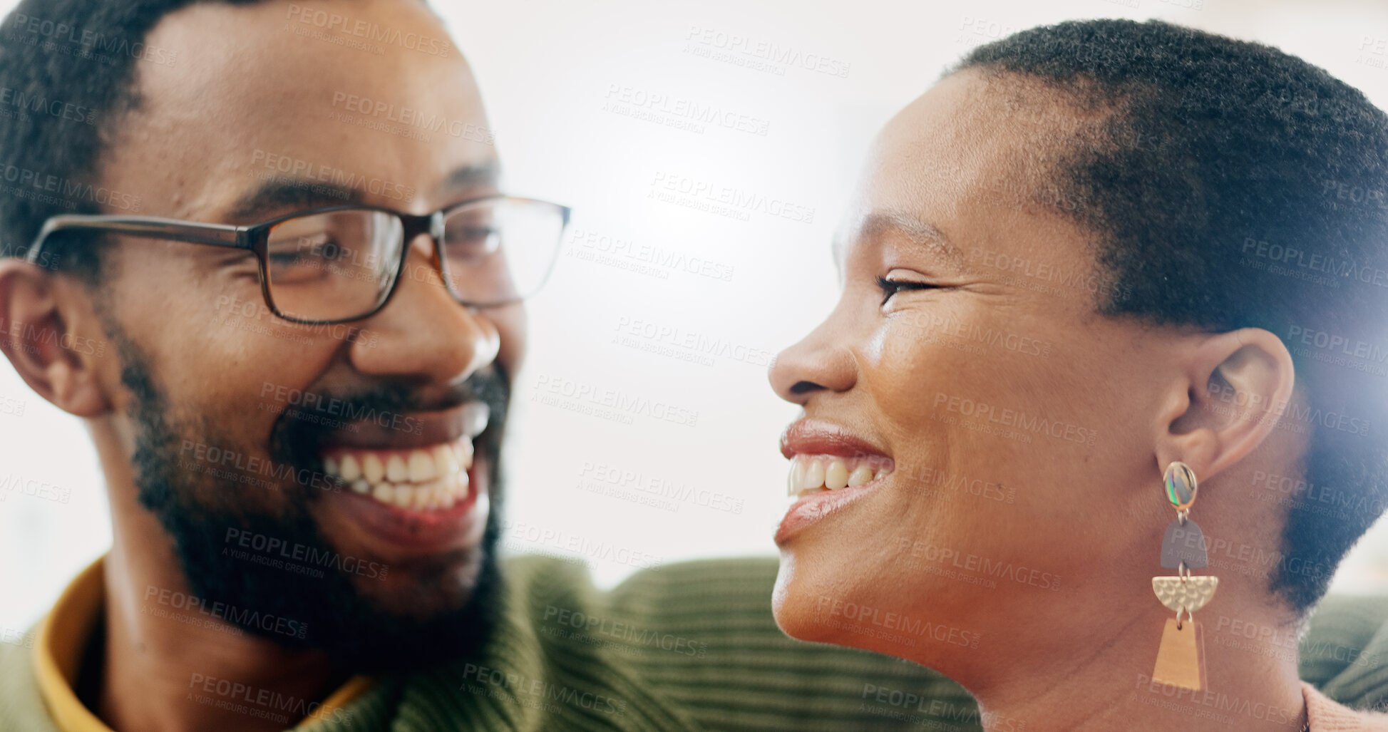 Buy stock photo Black couple, relax and home with love, support and care together on a living room sofa with smile. Date, romance and  happy people in the morning with communication and bonding in a house lounge