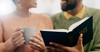 Buy stock photo Closeup, hands and a couple reading the bible together in the morning for spiritual wellness. House, support and a man and woman with coffee, talking and a book for religion education and studying