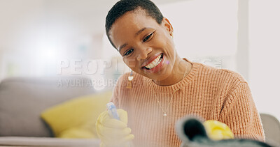 Buy stock photo Cleaning, happy and woman with spray for furniture in living room for hygiene, housework and maintenance. Housekeeping, products and person with gloves for bacteria, dirt and dust on surface in home