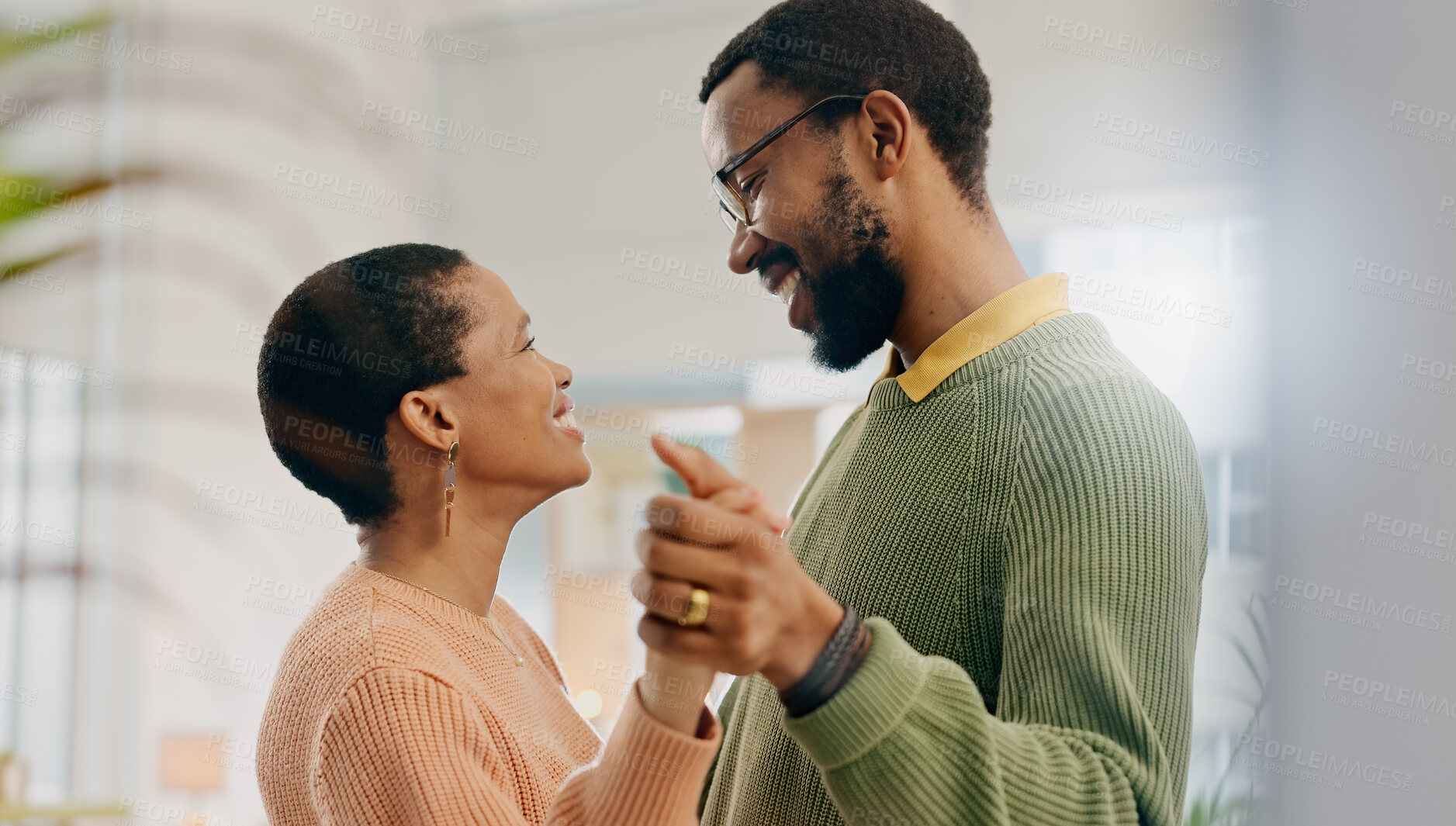 Buy stock photo Home, dancing and black couple with love, marriage and romance with lens flare, smile and care. Romantic, man and woman with energy, relationship and celebration with support, anniversary and joy