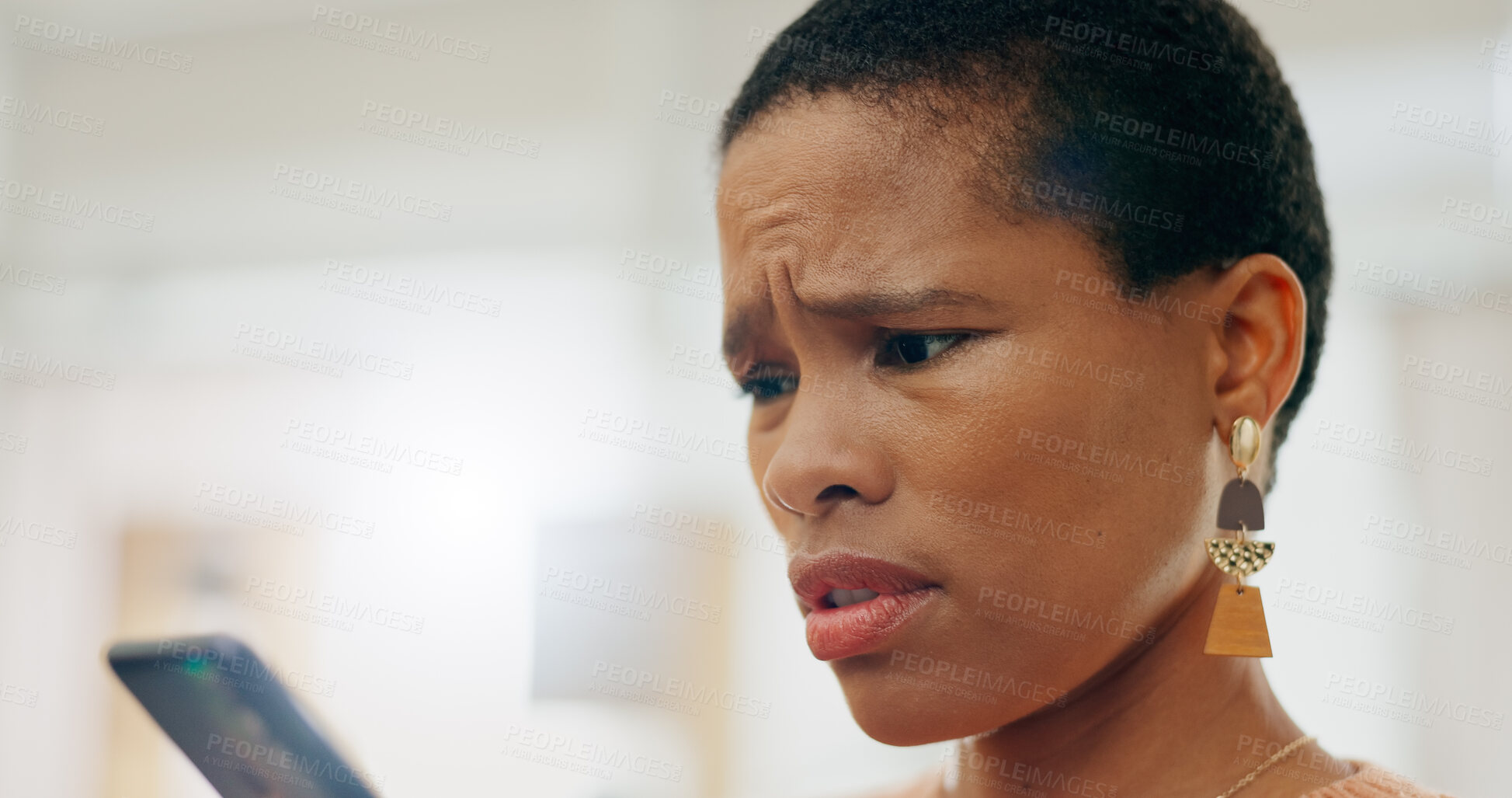 Buy stock photo Confused, sad and black woman with a phone for communication, bad news or a breakup online. House, problem and an African girl reading an email, social medi notification or app with fear on a mobile