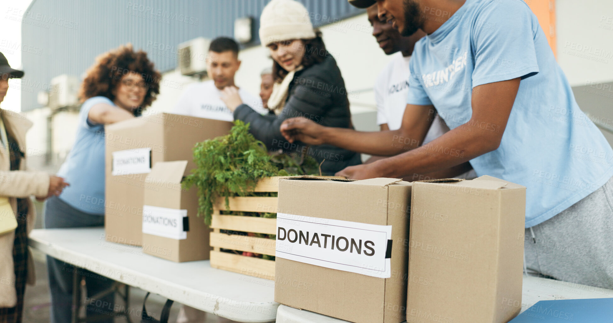 Buy stock photo Teamwork, people volunteering and food boxes on table for charity event with care, kindness and trust. Community donation, men and women at ngo with grocery package distribution at non profit project