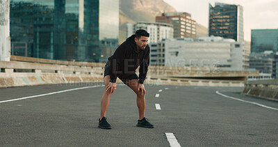 Buy stock photo Man, athlete and breathe in road for fitness, exercise or wellness with city background or nature. Runner, person and relax or tired for workout, training and healthy body with sportswear in street