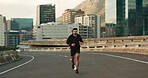 Athlete, morning and running in city street, road and bridge for fitness, workout and marathon training. Man, person or exercise in South Africa for cardio wellness, health or triathlon performance