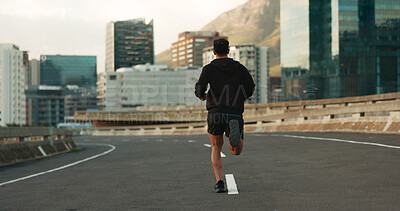 Buy stock photo Man, back and running in morning on city, street and bridge for fitness, workout and marathon training. Athlete, person or exercise on South Africa road for wellness, health or triathlon performance