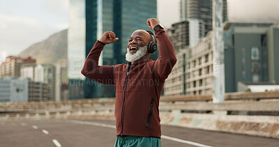 Exercise, celebration and senior man, headphones, city and achievement with workout, streaming music and radio. African person, pensioner and runner with headset, progress and fitness wellness or joy