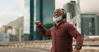 Fitness, celebration and senior man, headphones, city and achievement with workout, streaming music and radio. African person, pensioner and runner with headset, progress and exercise wellness or joy