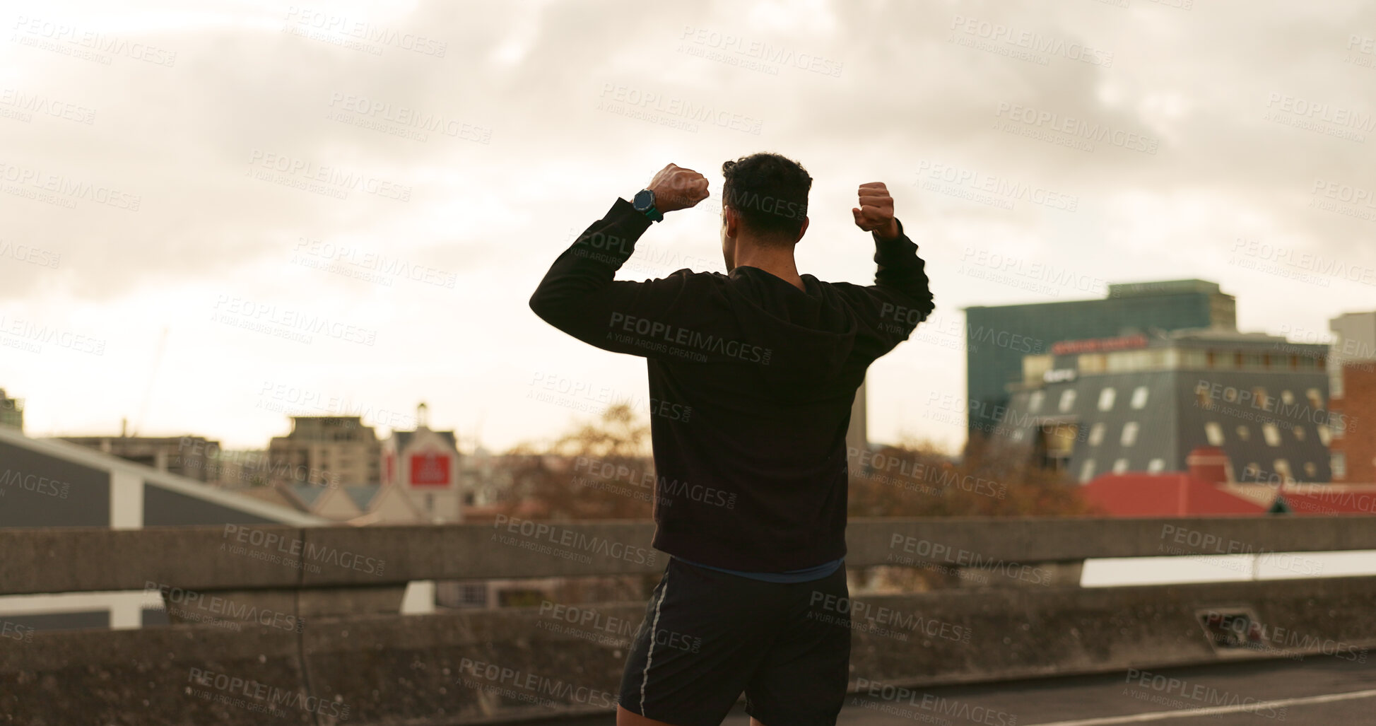 Buy stock photo Man, runner or victory in city for exercise time, fitness progress or training goal. Male person, athlete or cheers or workout performance on cloudy morning in street, challenge or health celebration