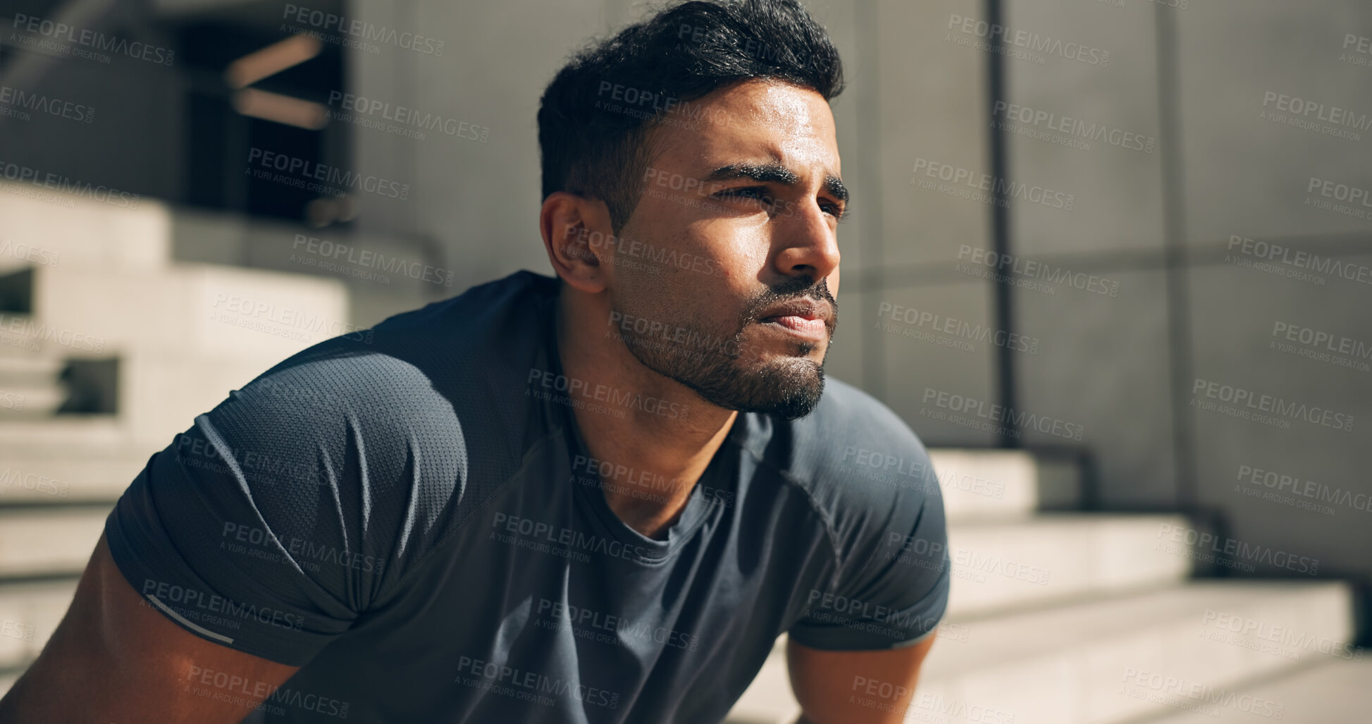 Buy stock photo Face, exercise and a tired sports man outdoor in the city for commitment to health or wellness. Fatigue, breathing and sweating with an exhausted young athlete in an urban town for fitness training