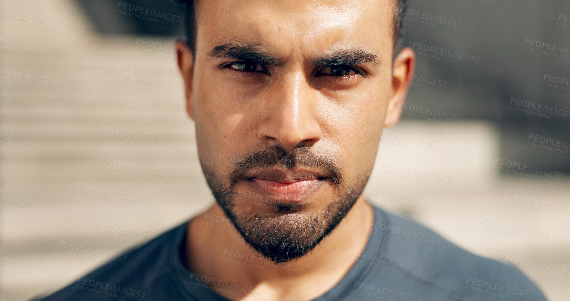 Buy stock photo Portrait, exercise and a serious sports man outdoor in the city for commitment to health or wellness. Face, breathing and sweating with a confident young athlete in an urban town for fitness training