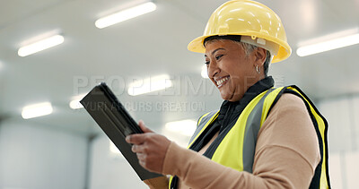 Engineering, woman and tablet at construction site inspection, building development and industrial renovation. Excited manager on digital tech, design software and architecture planning in warehouse