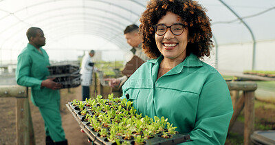 Buy stock photo Woman, tray of plants and portrait in greenhouse for agriculture, eco friendly gardening and sustainable farming. Farmer or people with green sprout, vegetables growth and happy for agro development