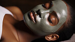 Woman wearing mask on face in spa beauty salon. Relaxed woman, skin beauty treatment