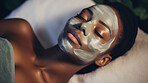 Woman wearing mask on face in spa beauty salon. Relaxed woman, skin beauty treatment