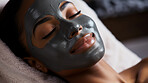 Woman wearing mask on face in spa beauty salon. Relaxed woman, skin beauty treatment