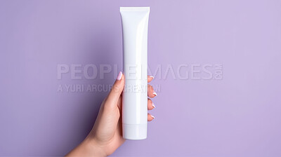 Close up of hand holding tube cosmetic product. Skincare hygiene moisturiser