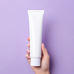 Close up of hand holding tube cosmetic product. Skincare hygiene moisturiser