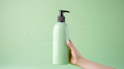 Close up of hand holding a shampoo or cosmetic product. Skincare hygiene moisturiser