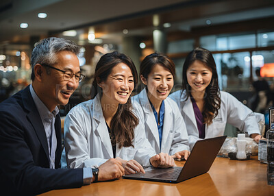 Buy stock photo Medical professionals looking at laptop. Sitting at desk smiling. Medical concept.