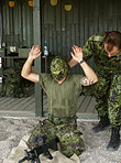 Military, exam to assemble a gun with a man soldier outdoor in camouflage uniform for an exercise. Army, blindfold and a person training at bootcamp to build a weapon or rifle in record time