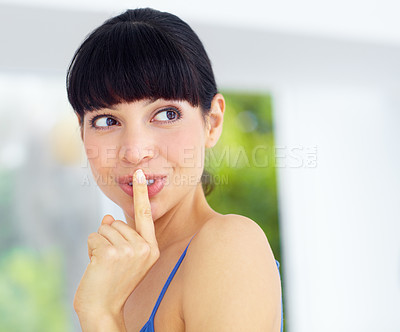 Buy stock photo Secret, gossip and young woman at her home with finger on her mouth in her modern home. Whisper, silence hand gesture and female person from Canada with a quiet or hush facial expression in her house