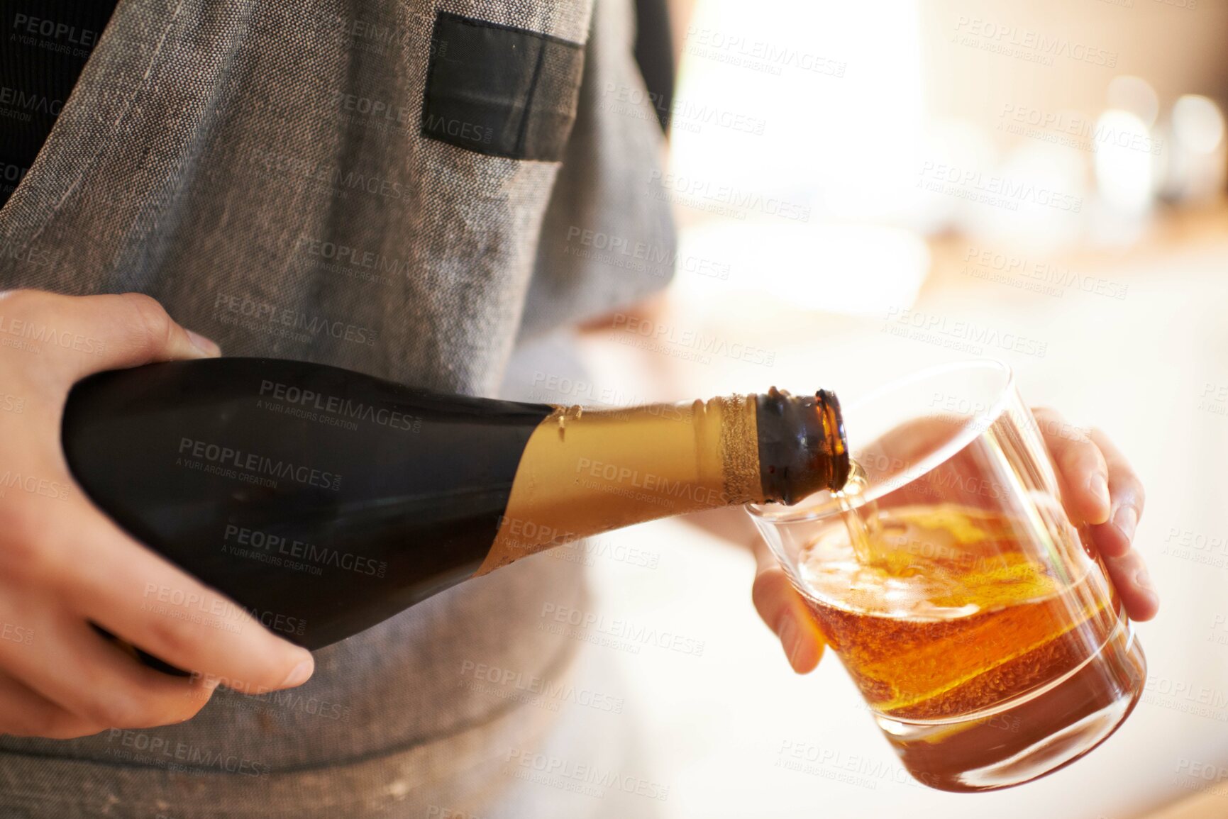 Buy stock photo Cropped view of a woman's hands pouring a drink