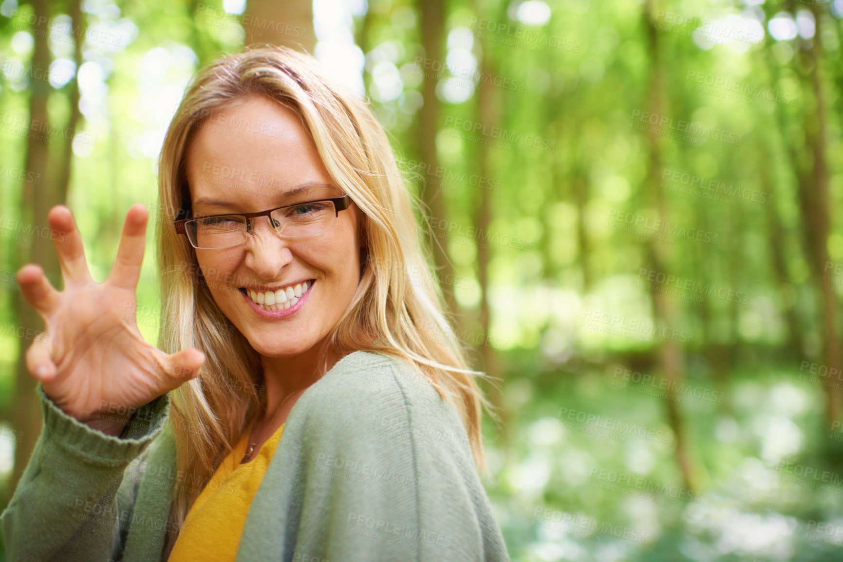 Buy stock photo Woman, glasses or nature with hand for playful, growl by countryside with portrait in trendy fashion. Sweden, person or happy face for eyewear in natural glow, outdoor fun or sunshine to joke in park
