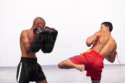 Buy stock photo Two young fighter practicing together in a gym