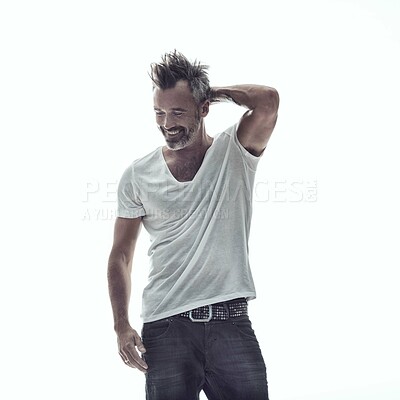 Buy stock photo Fashion, happy and a senior man model in studio isolated on a white background for trendy or relaxed style. Smile, confidence and clothes with a mature male person in a fashionable jeans outfit