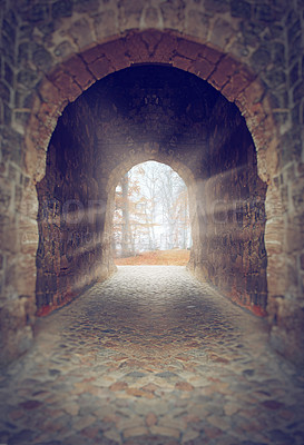 Buy stock photo Archway, passage and lens flare light for hope in dark church, castle and vintage building in nature. Path, corridor and old brick infrastructure with summer sunshine leading to forest and woods