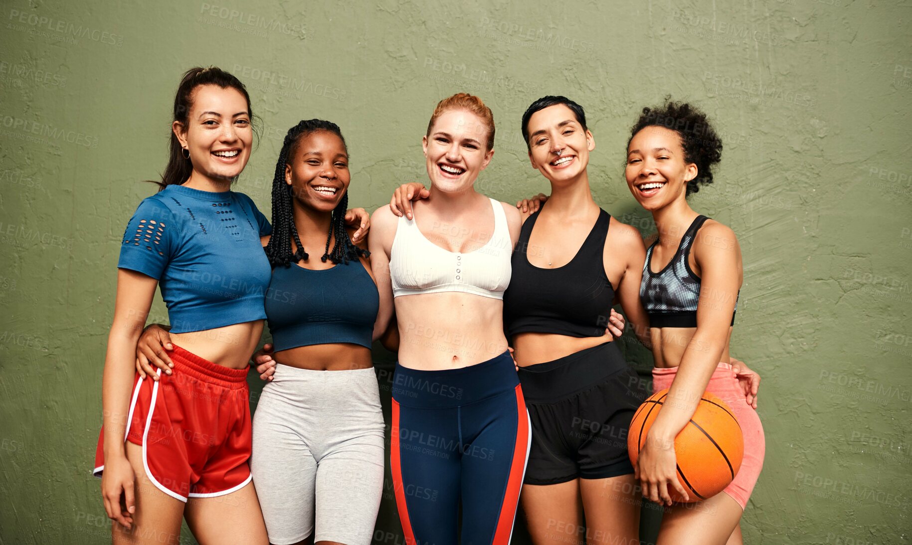 Buy stock photo Cropped shot of a diverse group of sportswomen standing together after a basketball game during the day