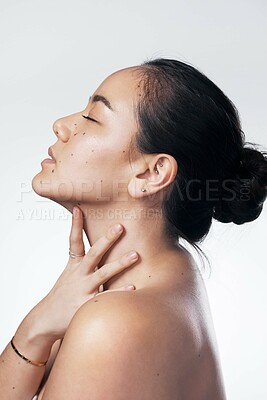 Buy stock photo Cropped shot of a beautiful young woman posing against a white background