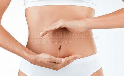 Buy stock photo Stomach, wellness and hands of woman in studio for digestion, gut or health on white background. Abdomen, detox and lady person with finger shape for healthy, balance or weight loss, control or diet